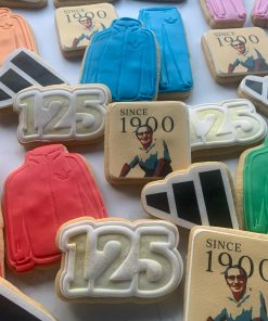 Fondant decorated sugar cookies celebrating 125 years of Adidas. Collection includes signature tracksuit, 125 shaped cookie, Adidas logo cookies and image of founder printed onto square cookie